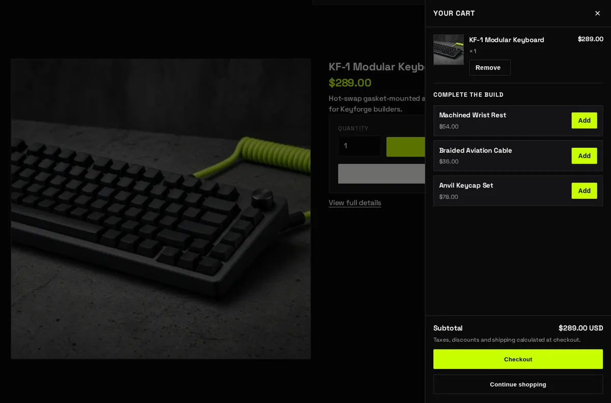 The cart drawer open on the right of a product page, showing one keyboard in the cart, three suggested add-ons each with an Add button, the subtotal and a Checkout button.